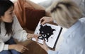 Psychotherapist Testing Female Patient Showing Inkblot Picture Sitting In Office