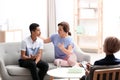 Psychotherapist working with African-American teenage boy and his mother Royalty Free Stock Photo