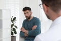 Psychotherapist working with drug addicted man indoors Royalty Free Stock Photo