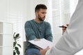 Psychotherapist working with drug addicted man indoors Royalty Free Stock Photo