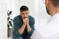 Psychotherapist working with drug addicted man indoors Royalty Free Stock Photo