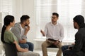 Psychotherapist working with group of drug addicted people at therapy session indoors Royalty Free Stock Photo