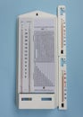 Psychrometric hygrometer isolated on blue background.simple device for measuring air humidity in a pharmacy