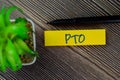 PTO write on sticky notes isolated on Wooden Table
