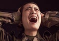 PTSD, crying and trauma with a woman soldier shouting or screaming in studio on a dark background. Scream, grief and Royalty Free Stock Photo