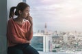 PTSD Mental health concept, Young depressed asian woman sitting near window with low light environment.Selective focus Royalty Free Stock Photo