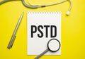 PTSD text written a on paper with a stethoscope. Medical concept