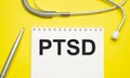 PTSD text written a on paper with a stethoscope. Medical concept