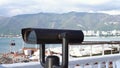 Public beach binoculars, operated with coins with the ocean in the background. Media. Touristic binoculars, optical