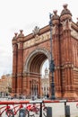 Public bike system bicycles next to the Triumphal Arch in Barcelona Royalty Free Stock Photo