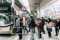 Public Bus station in Hong Kong with line queue of people waiting on the street Royalty Free Stock Photo