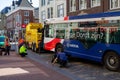 Public bus stuck on retractable bollards with tow truck