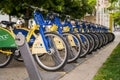 Public city bicycles parked in a rack