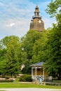 Public city park and Baroque-style belfry of Loustarikirkko medieval convent church in Naantali, Finland