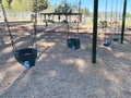 public city park children playground play swing set swings play area Royalty Free Stock Photo