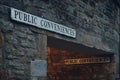 Public conveniences toilet signs on a building in Stow on the Wold, Cotswolds, UK Royalty Free Stock Photo