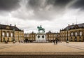 Public courtyard with a bronze statue of a man on a horse in the middle of the Queens palace in Copenhagen. Copenhagen, Denmark