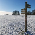 Public direction sign on parkland in Sussex, England.