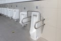 Public disabled toilet in a large building. Modern restroom for disabled people. Inside disable toilet or elderly people. Handrail Royalty Free Stock Photo