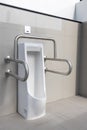 Public disabled toilet in a large building. Modern restroom for disabled people. Inside disable toilet or elderly people. Handrail Royalty Free Stock Photo