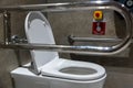 Public disabled toilet in a large building. Modern restroom for disabled people. Inside disable toilet or elderly people. Royalty Free Stock Photo