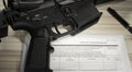 Public domain background check form with an assault rifle