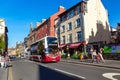 Public double decker bus at typical street in Edinburgh Royalty Free Stock Photo