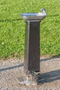 Public drinking water tap in the public park. Royalty Free Stock Photo