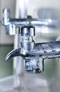 Public faucet and water drop Royalty Free Stock Photo