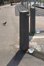 Public fountain in the park with containers of water to quench the thirst of all the animals that stop by to drink Royalty Free Stock Photo