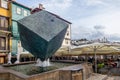 Public fountain, street in Porto, Portugal and colorful houses