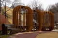 Public gazebos made of wood, of unusual shape. Royalty Free Stock Photo