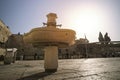 Public golden mugs for ritual of hand washing at the Western Wall located in the old city Jerusalem at the foot of the western