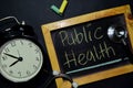 Public Health handwriting on chalkboard on top view. Royalty Free Stock Photo