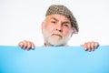 Public information. Announcement concept. Senior bearded man peek out of banner place information. Advertisement elderly Royalty Free Stock Photo