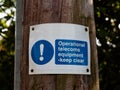 A public information sign warning of operational telecoms equipment - keep clear