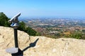 Public monocular with scenic view to San Marino city from height