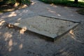 Public multifunctional playground with a sandy impact zone and a stainless steel slide in the park with a sandpit, a climbing Royalty Free Stock Photo