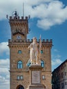 Public Palace Tower Clock and Statue of Liberty in San Marino Royalty Free Stock Photo