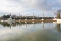 Public park with a large lake that reflects in the water the decorative architecture of the park, Tres Cantos, Madrid. Royalty Free Stock Photo