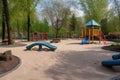 public park with playground and swings for children to play Royalty Free Stock Photo