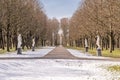 Public park with row of statues in wintertime