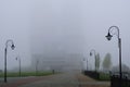 Public park and silhouette tall building in fog