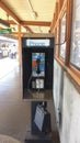 Public phone booth on elevated subway train platform