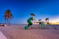 Public playgraound at Playa de las Arenas beach in Valencia at dawn, Spain