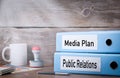 Public Relations and Media Plan. Two binders on desk in the office. Business background Royalty Free Stock Photo