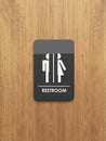 Public restroom sign on the wood Royalty Free Stock Photo