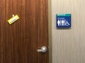 Public restroom toilet door for male and female and handicap with blue signs