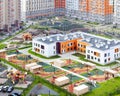 Public school building. Exterior view of school building with playground mixed-use urban multi-family residential Royalty Free Stock Photo