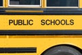 Public schools block lettering on the side of a school bus